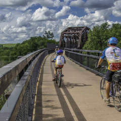 Cyclists biking over Keystone Viaduct